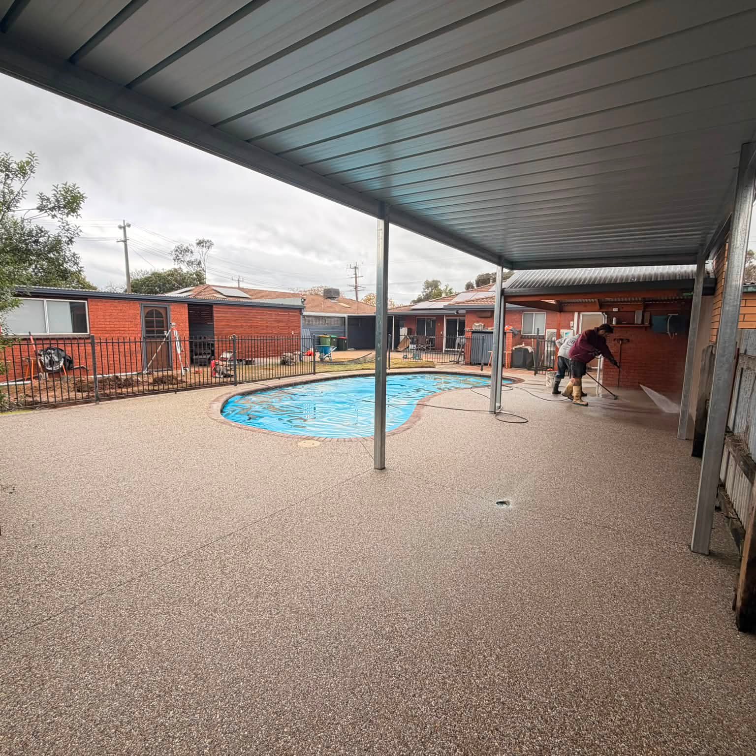 Completed exposed aggregate concrete pool surround by Tom Body Concrete in Kyabram, Victoria