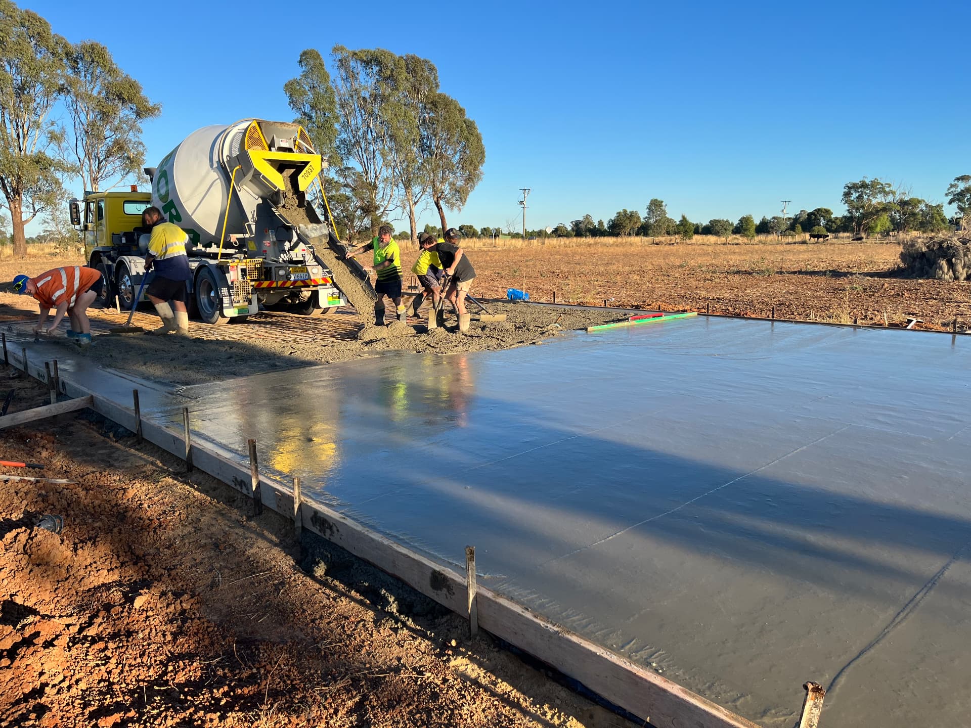 Tom Body Concrete crew pouring a large commercial concrete slab with a concrete truck in Kyabram